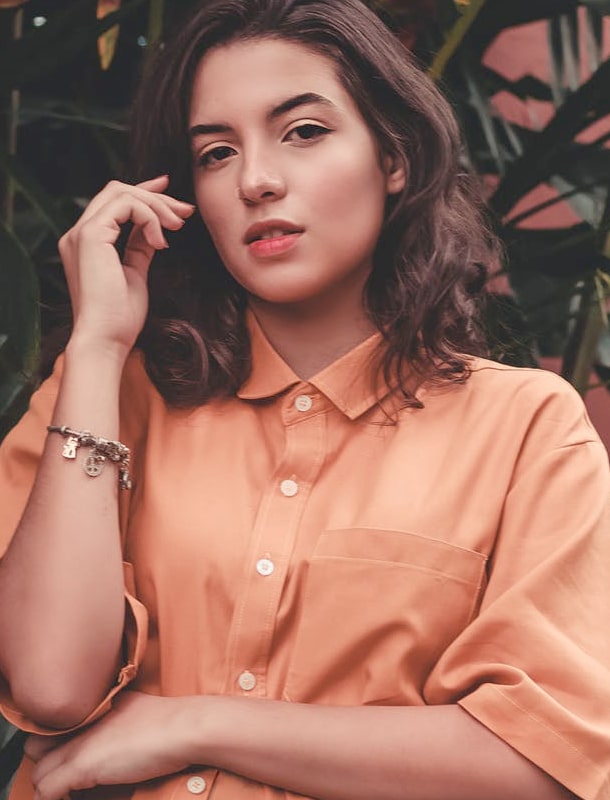 woman in orange shirt